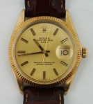 Relógio de pulso masculino Rolex - Oyster Perpetual Date Superlative Chronometre Officialy Certified , em ouro amarelo 18k, fivela original, pulseira em couro, caixa med. 30 mm