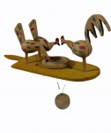 Brinquedo em madeira policromada, um galo e duas galinhas articulados sobre base de madeira. Alt. 19 x 7 x 22 cm.
