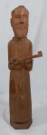 ARTE POPULAR. SATURNINO. Escultura em madeira representando Frade com chave. Alt. 42 cm.