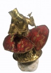 TATI MORENO . Escultura em metal dourado, representando Ossaim.  Assinado, localizado e datado Bahia, 2005. Alt. 28 cm.