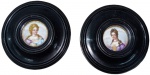 Duas miniaturas de pinturas em porcelana . "Retrato de Damas de época", medindo 9 cm. cada de diâmetro. Emolduradas, 24 cm. cada.