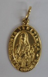 Medalha em ouro amarelo, contrastado 18k, representando Santa Terezinha, peso 1.29 g, medida aproximada 20mm.