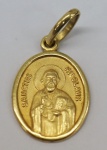 Medalha em ouro amarelo, contrastado 18k, representando São Nicolau, peso 1.36 g, medida aproximada 18mm.