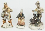 Conjunto de 3 peças em porcelana italiana policromadas , representando Leitor de jornal ( 33 cm), Caçador (30 cm) e Costureira(24 cm) .