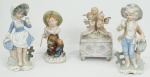 Conjunto de 4 peças  , contendo : casal de camponeses em porcelana policromada. (20 cm cada) e 2 biscuit  sendo  pescador (15 cm)  e caixa de jóias com anjos ( 16 cm).