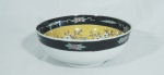 Bowl de porcelana chinesa, emalte amarelo e negro, dedoração de flores e pássaros, med 7 cm de altura x 21,50 de diâmetro.