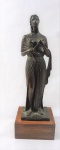 HONÓRIO PEÇANHA .  Escultura em bronze patinado, representando Divindade Grega, com a inscrição "EUTERPE", assinado no verso H.Peçanha, medindo 23 cm, base em madeira medindo 4 cm. Medida total 27 cm