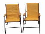 CARLO HAUNER - Par de poltronas com estrutura em ferro tubular, assento em madeira nobre de jatobá, estofado em tecido amarelo. Medindo 90 x 63 x 65 cm cada