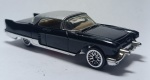 Hot Wheels Black 2001 1957 Cadillac Eldorado Brougham Malaysia, preto, feito de metal  escala 1/64, medindo 8x3 cm.
