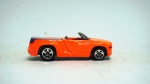 Hot Wheels- Dodge Sidewinder, escala 1/64, laranja neon e roxo, metal die-cast, med 6,5 x 2,5 cm.